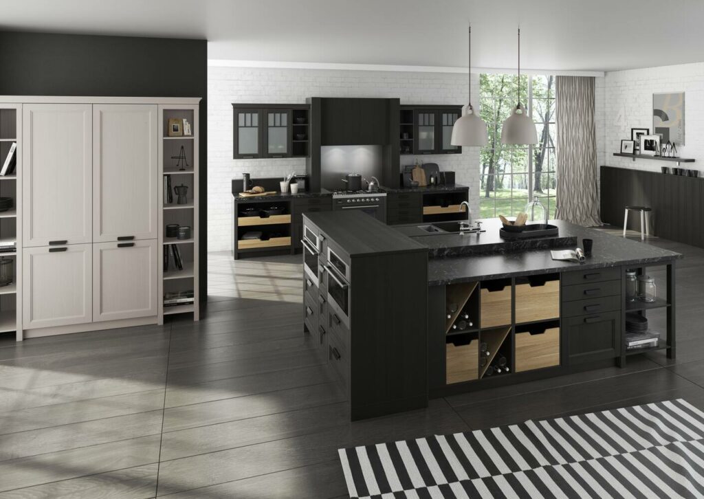 Modern kitchen with black cabinets, built-in appliances, and light wood accents. The space includes an island, pendant lights, and a striped rug on dark wood flooring. Large windows provide natural light, creating the perfect setting to explore tips on how to organize kitchen cabinets efficiently.