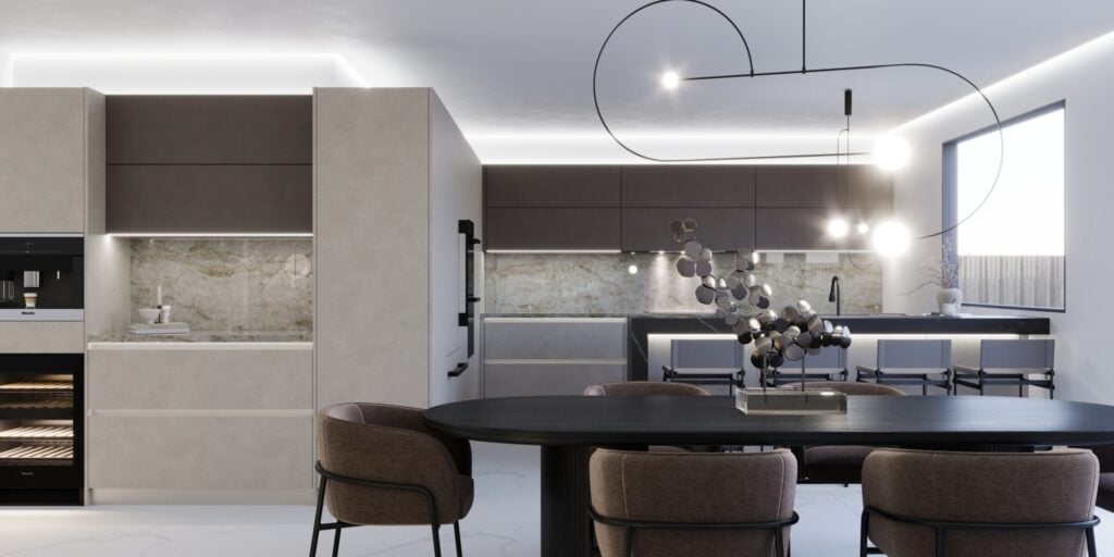 Modern kitchen cabinets and dining area with sleek brown finish, marble walls, a round black table, plush chairs, and stylish hanging lights.